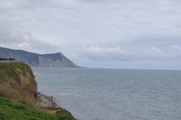 View of the Black Sea, beach and mountains. The resort town of Anapa. Russia. Photo taken in spring.