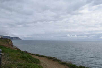 View of the Black Sea, beach and mountains. The resort town of Anapa. Russia. Photo taken in spring.