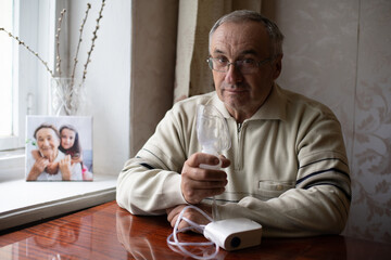 Elderly man on oxygen mask, nebulizer