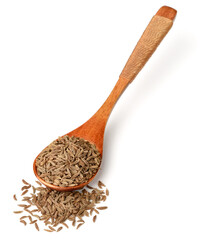 dried caraway seeds in the wooden spoon, isolated on white
