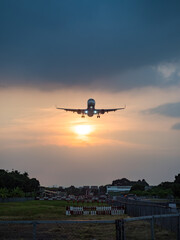 Fototapeta na wymiar Airplane Landing in Taipei city, Taiwan.