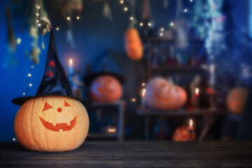 Halloween pumpkins on old wooden table on background Halloween decorations