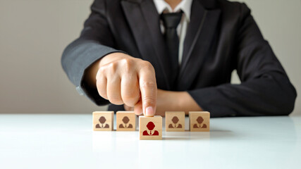 Businessmen choose wooden blocks that show outstanding people from the crowd. Or as a successful team leader HR and CEO