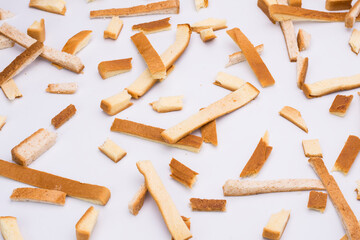 Scattered crumbs isolated on white background