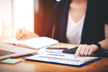 Asian woman working through laptop. business woman busy working with laptop computer at office