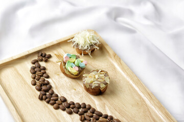 Martabak Mini or Martabak Mini Bangka with various Topping. The martabak mini bangka is made from a mixture of flour, eggs, sugar, baking soda, coconut milk and water.