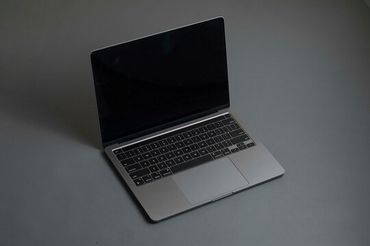 Grey laptop on Grey background