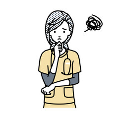 立って手をあごにあてて困っている看護師の女性