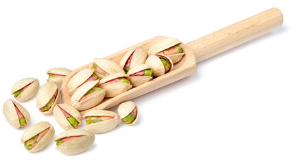 pistachios nuts in the wooden scoop, isolated on the white background