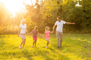 Fototapeta premium Happy family together bonding outdoors