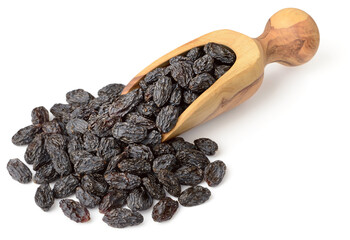 black raisins in the wooden scoop, isolated on white background