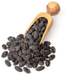 black raisins in the wooden scoop, isolated on white background