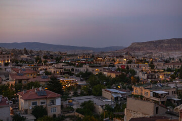 Cappadocia, Turkey - September 1, 2021 –impressive Fairy chimney formations rising up around Goreme town centre, Cappadocia, Turkey. Cappadocia, Nevsehir, Turkey