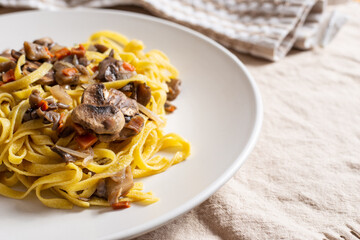 Italian homemade tagliatelle with mushrooms