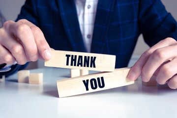 Wooden blocks with the inscription 'thank you'.