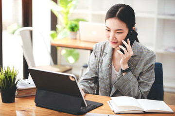 Business woman talking on the phone, laptop, computer, business technology concept.