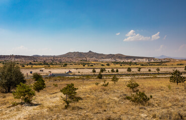 Cappadocia, Turkey - September 1, 2021 – Impressive nature by chimney rock formations and rock pillars of “love Valley” near Goreme, Cappadocia, Nevsehir, Turkey
