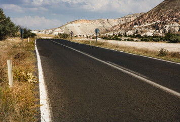 Cappadocia, Turkey - September 1, 2021 – Impressive nature by chimney rock formations and rock pillars of “love Valley” near Goreme, Cappadocia, Nevsehir, Turkey