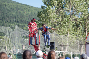 two circus people performing with audience watching © marcos