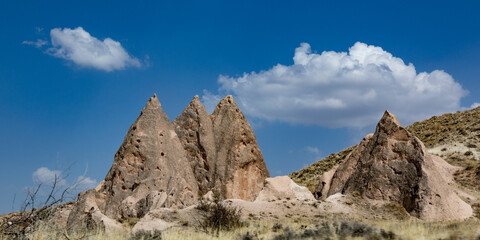 Cappadocia, Turkey - September 1, 2021 – Impressive nature by chimney rock formations and rock pillars of “love Valley” near Goreme, Cappadocia, Nevsehir, Turkey