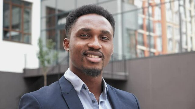 Portrait Of Charming Dark Skinned Man. Face Successful Businessman Architect Expert Alone. Person Looking at Camera Closeup. Confident Professional Business Man Turning Head to camera Smiling.