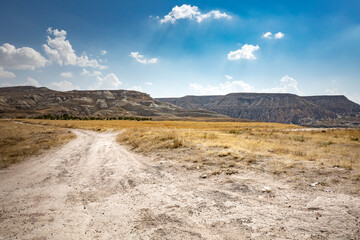 Cappadocia, Turkey - September 1, 2021 – Impressive nature by chimney rock formations and rock pillars of “love Valley” near Goreme, Cappadocia, Nevsehir, Turkey