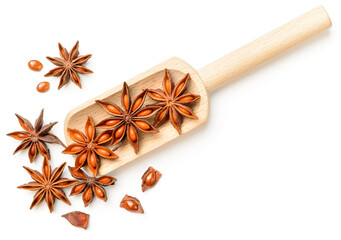 star anise in the wooden scoop, isolated on the white background, top view