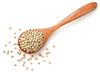 white peppercorns in the wooden spoon, isolated on the white background, top view