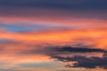 Colorful sunset background on a beautiful summer sky with clouds texture after rain