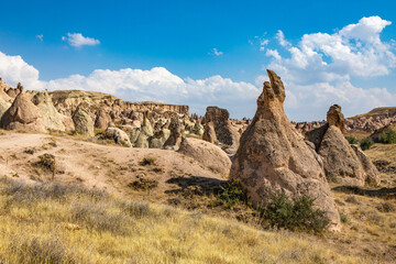 Cappadocia, Turkey - September 1, 2021 – Impressive nature by chimney rock formations and rock pillars of “love Valley” near Goreme, Cappadocia, Nevsehir, Turkey
