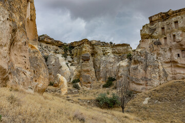 Cappadocia, Turkey - September 1, 2021 – Impressive ancient cave home which had been carved in the Vulcanic rock cliff face of Pigeon Valley at Uchisar in the Cappadocia region of Turkey.