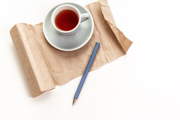 Pen and cup of coffee on white background. Office concept