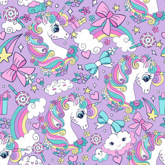 Vector seamless pattern with cute unicorns and magic elements © alinart
