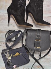 womens, handbag boots and a belt on a wooden table