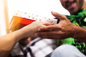 Close up of male hands holding Christmas gift box