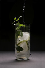 Mojito splash studio on black background
