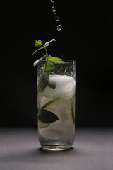 Mojito splash studio on black background
