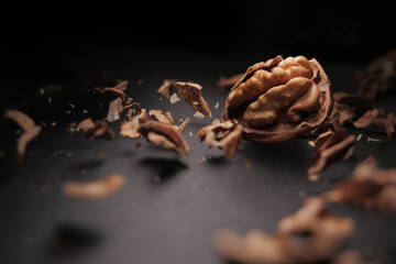 Nut studio shot with shell crumb on black background