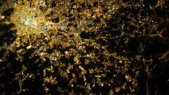Night lights aerial satellite view animation on city of Milan, Italy. Contains image furnished by Nasa