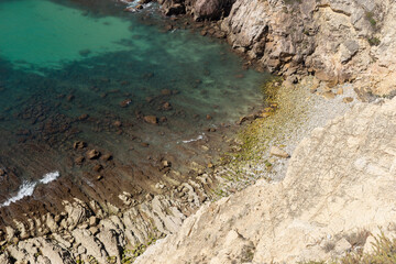 Rocky sea coast with turquoise water. A bay on the Mediterranean coast