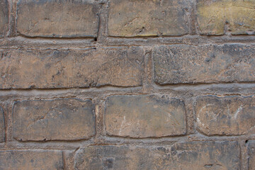 Yellow brick wall. Wall texture, background. Stock photo for wallpaper or texture