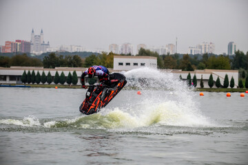 competition and freestyle in the program of competitions on aquabikes in open water on the lake 