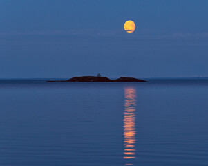 The moon over Lake Ladoga. - 457157569