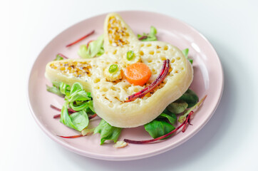 Funny and nice bunny shaped crumpets served with mix fresh vegetables, funny food for kids