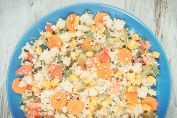 Fresh salad with couscous and vegetables. Light dietary vegan meal