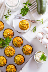 Homemade zucchini muffins with feta cheese and herbs