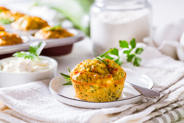 Homemade zucchini muffins with feta cheese and herbs