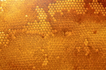 Bee honeycomb with honey, yellow honeycomb wax background. The concept of beekeeping 