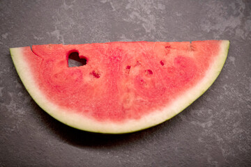 Fototapeta na wymiar a slice of watermelon with a heart-shaped hole