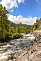 River in Canada running through a scenic forest and mountain range alongside the Sea to Sky highway from Whistler to Vancouver.